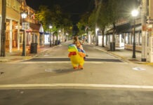a person in a costume walking down a street