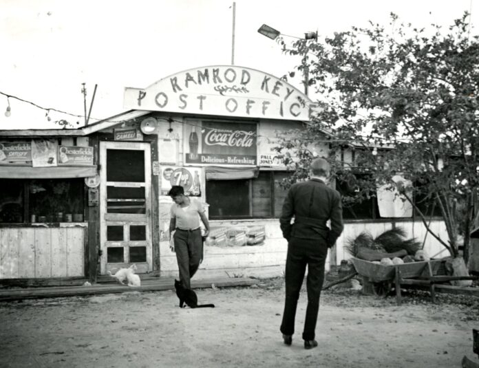 Ramrod Key Post Office a black and white photo of a man and a woman walking in front of a