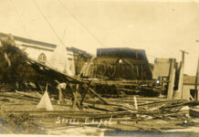 a black and white photo of a building that has been destroyed