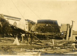 a black and white photo of a building that has been destroyed
