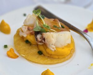 a white plate topped with food and a fork
