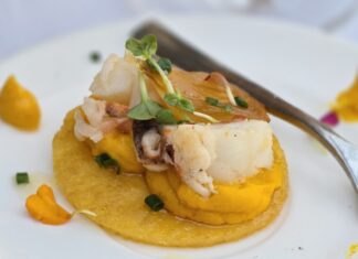 a white plate topped with food and a fork