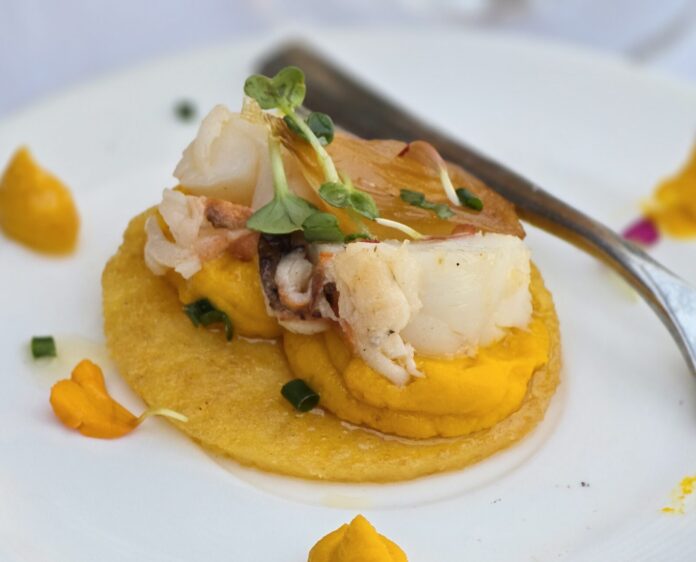 a white plate topped with food and a fork