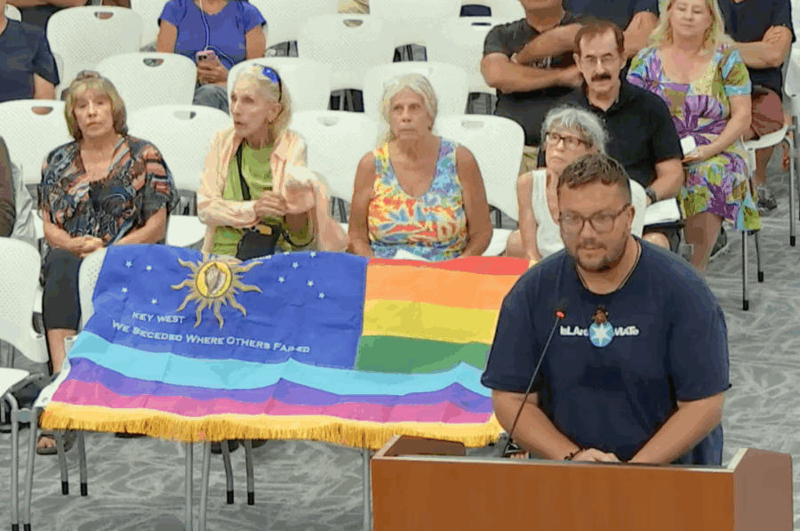 a group of people sitting in front of a podium