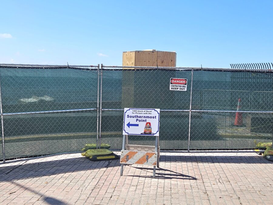a fenced in area with a sign on it