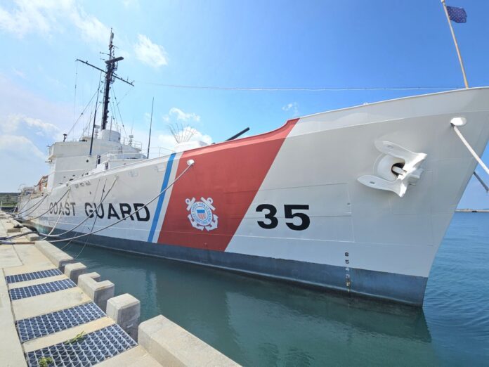 a large boat docked at a dock in the water