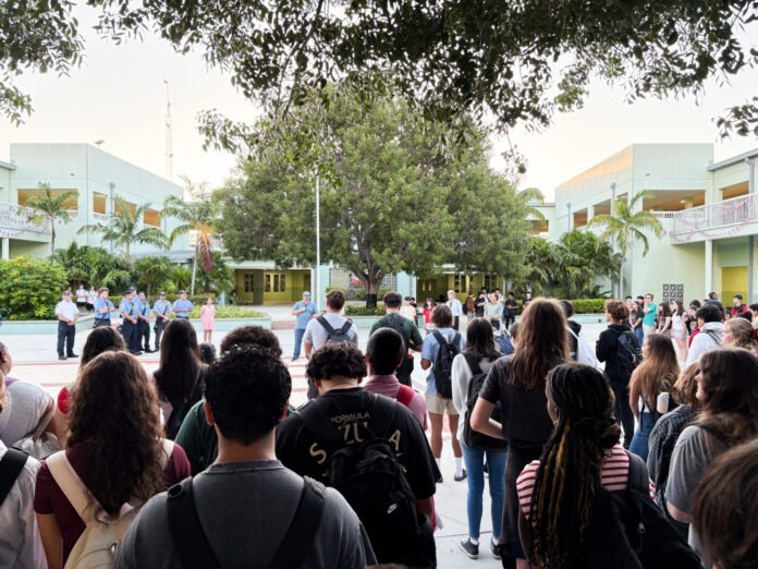 a large group of people standing in front of a building