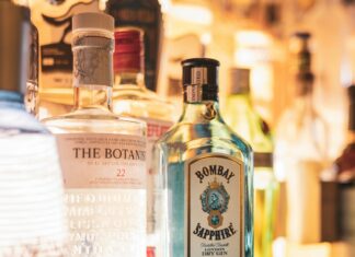 bottles of alcohol are lined up on a bar