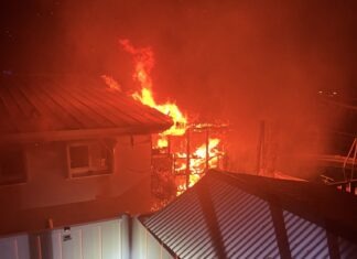 a house on fire at night