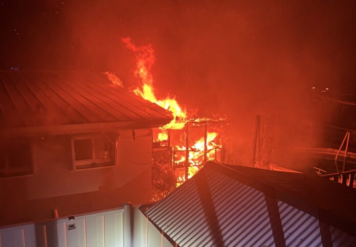 a house on fire at night