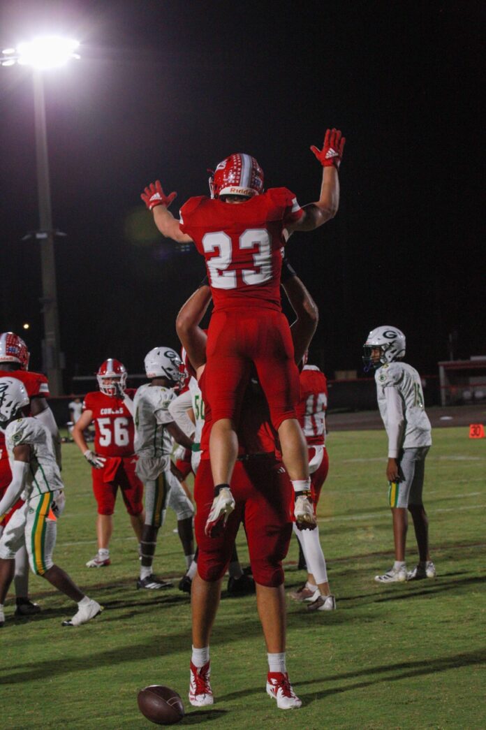 a football player is jumping in the air