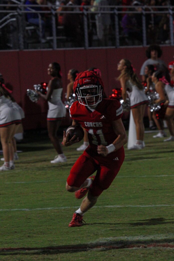 a football player running with the ball