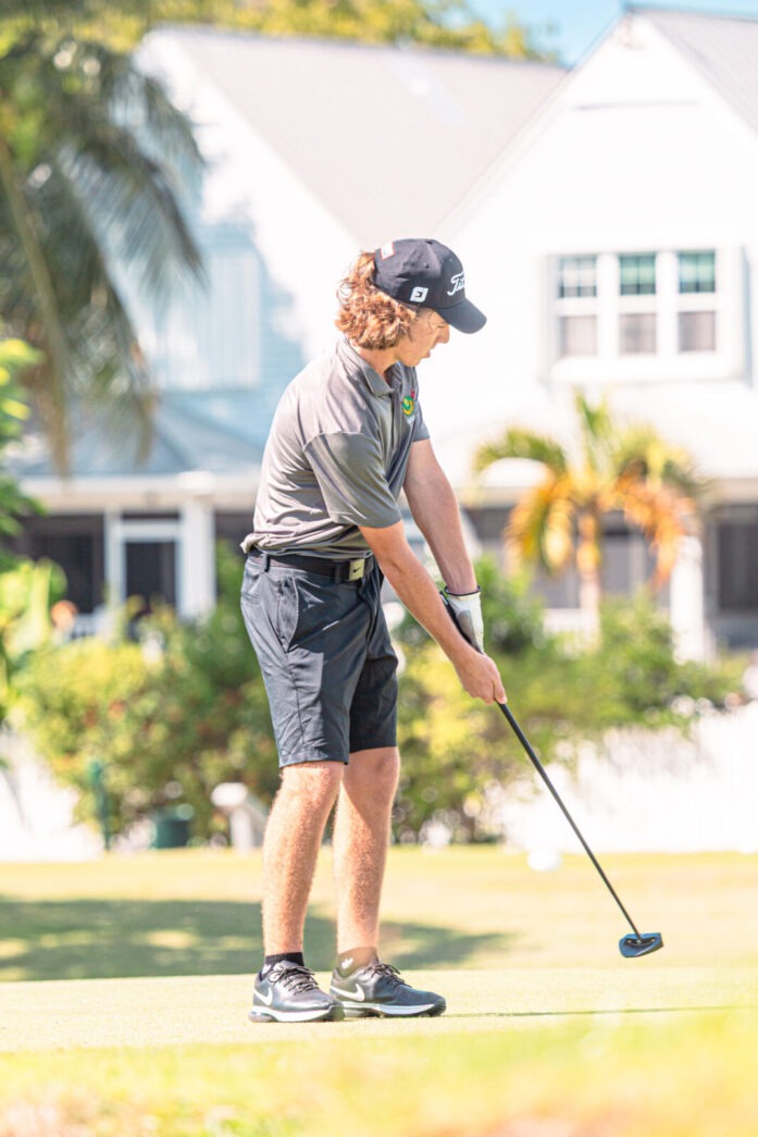 a man playing golf on a golf course