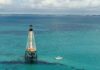 a light house in the middle of the ocean