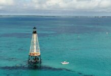 a light house in the middle of the ocean