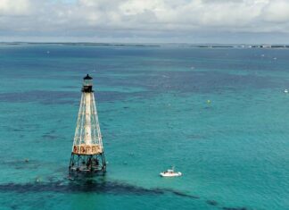 a light house in the middle of the ocean