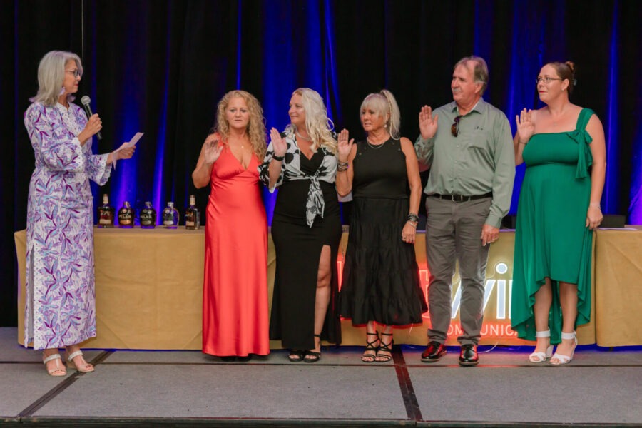 a group of people standing on top of a stage
