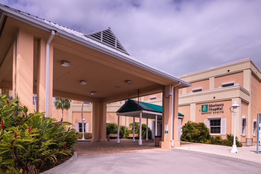 a large building with a green awning on top of it