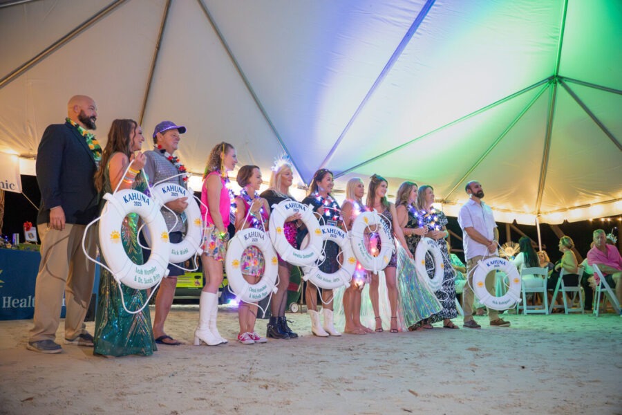 a group of people standing in front of a tent