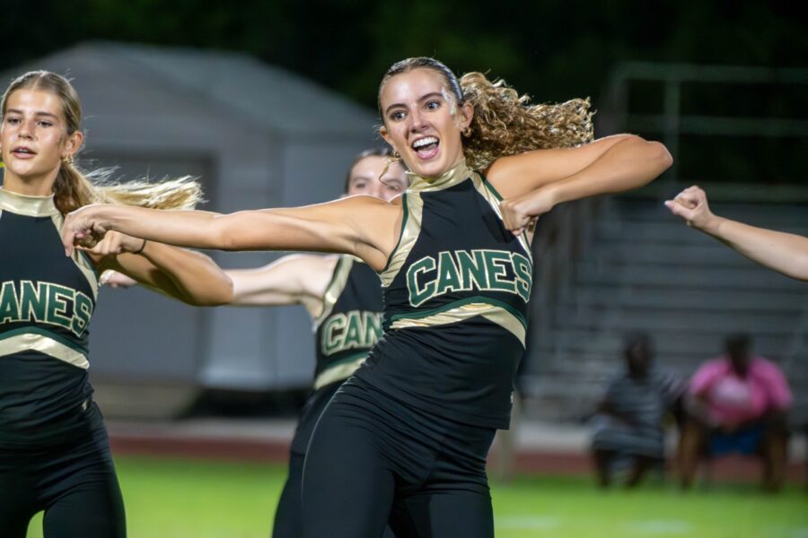 a group of cheerleaders performing a dance routine