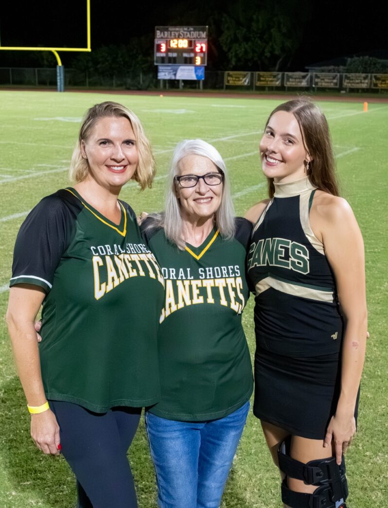 a group of women standing on top of a field