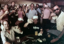 a group of people are posing for a picture
