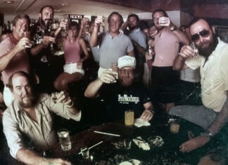 a group of people are posing for a picture