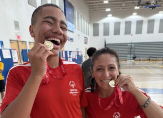 KEYS SPECIAL OLYMPIANS QUALIFY FOR STATE GAMES IN ORLANDO a man and a woman eating food in a gym