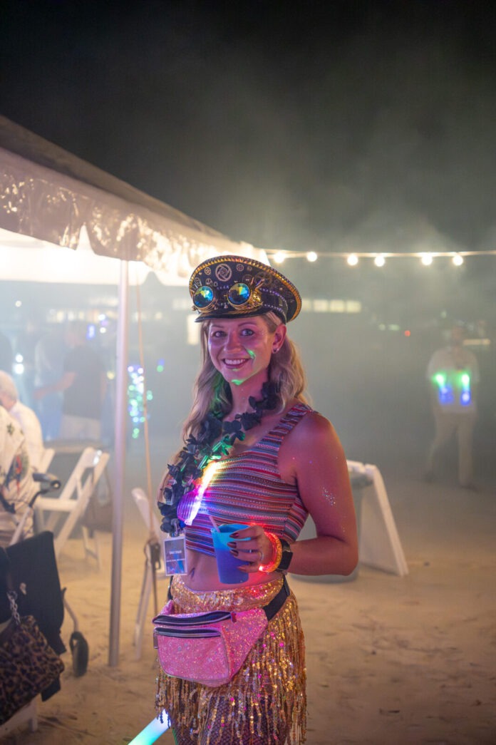 a woman in a costume holding a cup