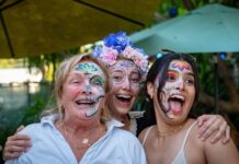 LOCAL BREWERY HOSTS DAY OF THE DEAD CELEBRATION a group of women with face paint posing for a picture