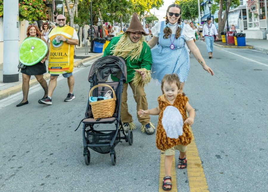 a group of people walking down a street