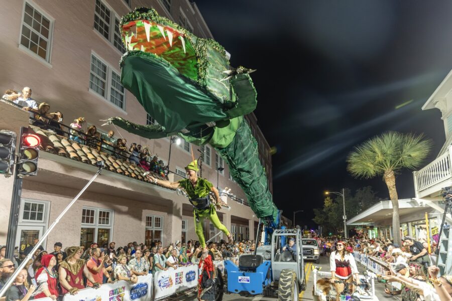 a parade float with a dragon on top of it