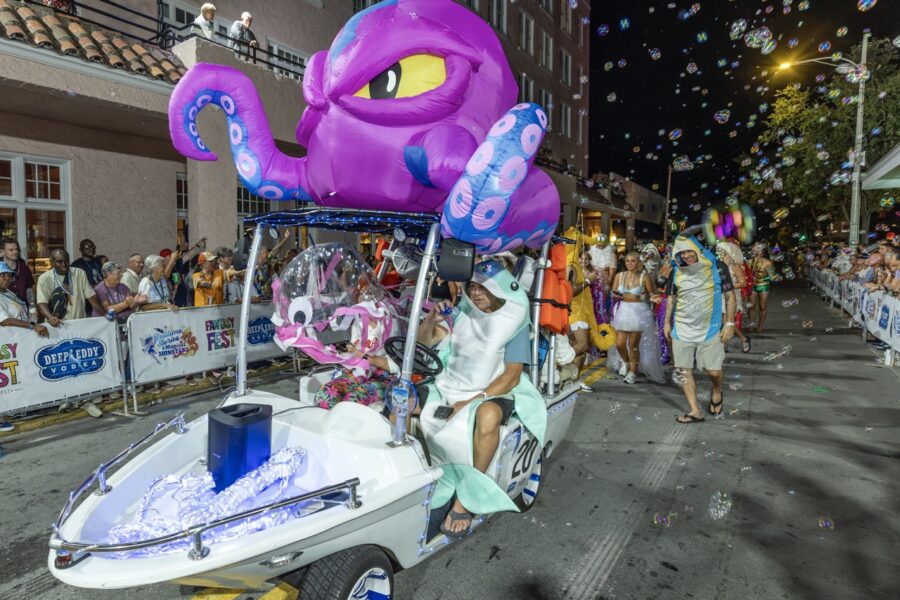 a parade float with a purple octopus on it