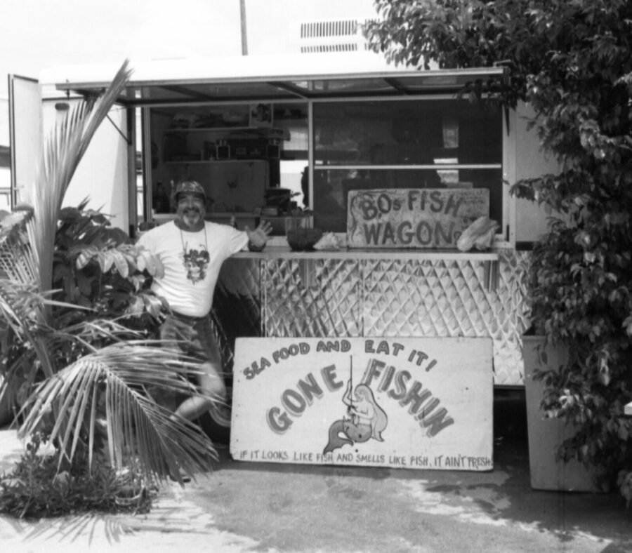a man standing in front of a food truck