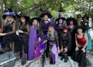KIDS GET SWEETS AND SCARES AT CRANE POINT’S WITCHES IN THE HAMMOCK a group of people dressed up in halloween costumes