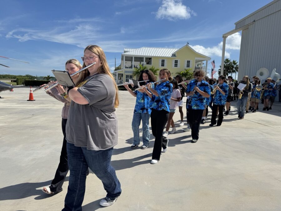 a group of people that are standing in front of a building