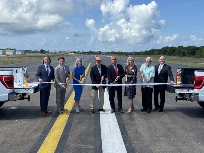 IMG_6393 2 Large a group of people standing in front of a truck