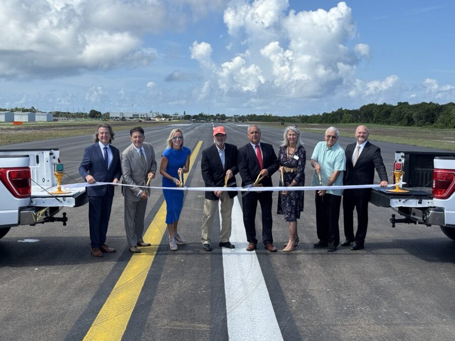a group of people standing in front of a truck
