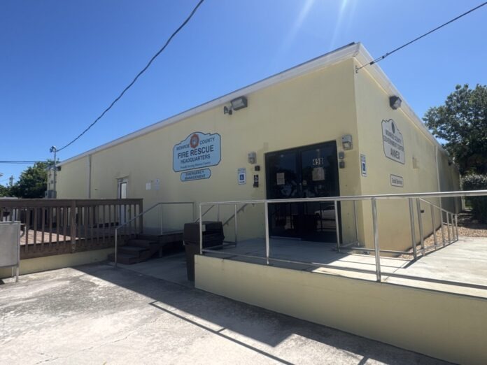IMG_6831 a yellow building with stairs leading up to it