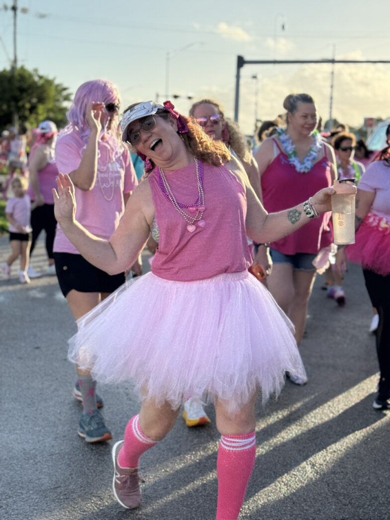 a woman in a pink shirt and pink tutu skirt