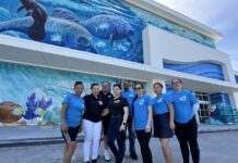 a group of people standing in front of a building