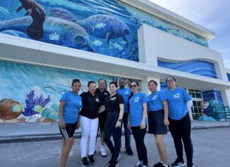 MAKING WAVES IN MARATHON: SURF STYLE OPENS ITS DOORS a group of people standing in front of a building