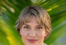 SARAH COMPTON CHALLENGES KEY WEST COMMISSIONER LISSETTE CAREY  a woman with short hair wearing a white shirt