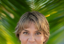 SARAH COMPTON CHALLENGES KEY WEST COMMISSIONER LISSETTE CAREY  a woman standing in front of a palm tree