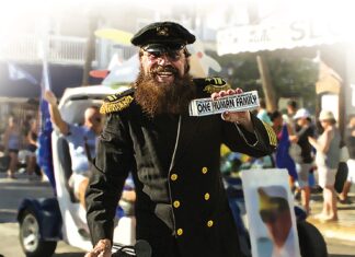 a man in a military uniform holding a sticker