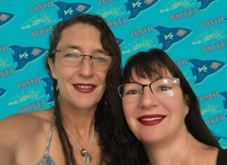 a couple of women standing next to each other