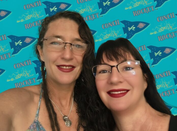 a couple of women standing next to each other