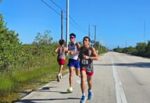 a group of people running down a road