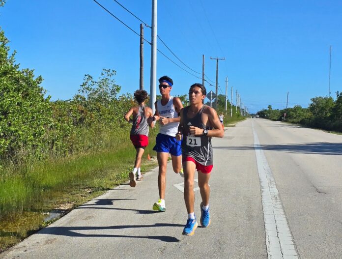a group of people running down a road
