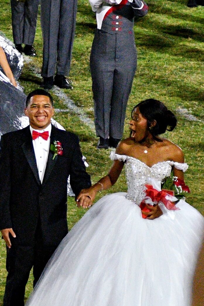 a man and a woman dressed in wedding attire